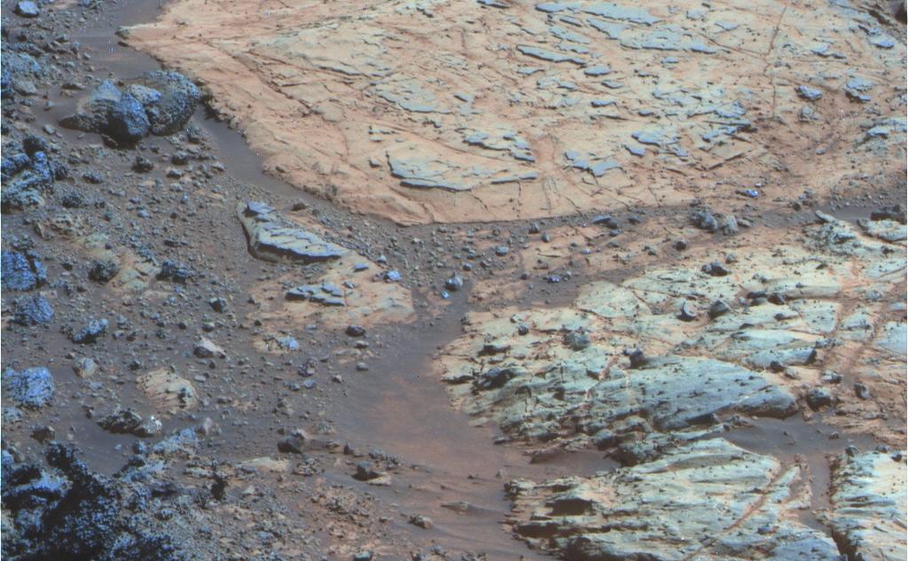 A rind that appears bluish in this false-color view covers portions of the surface of a rock called "Whitewater Lake" in the top half of the view from NASA's Mars Exploration Rover Opportunity.