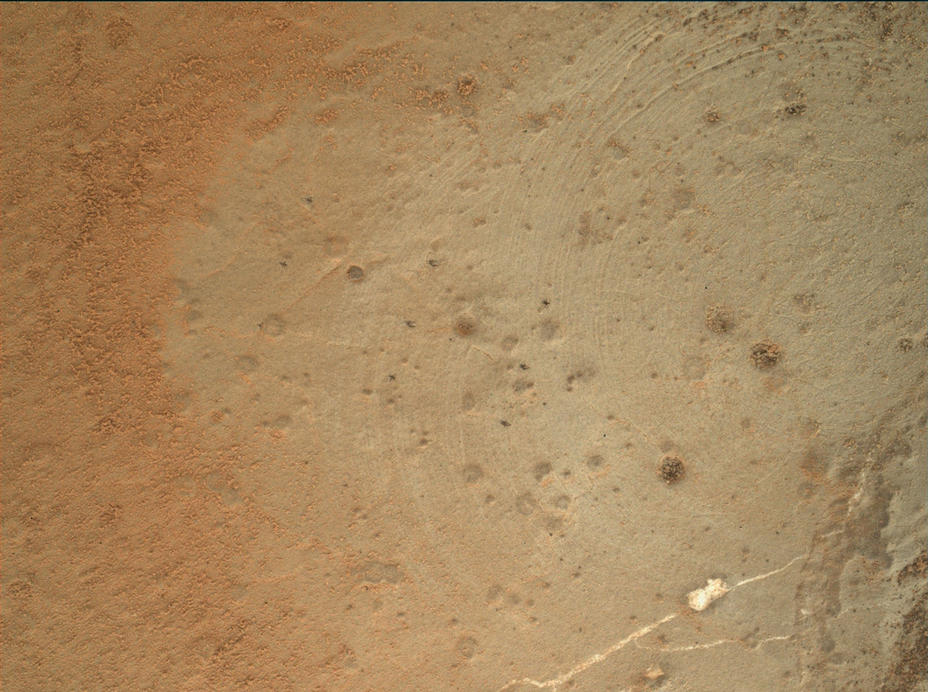 This image from the Mars Hand Lens Imager (MAHLI) on NASA's Mars rover Curiosity shows details of rock texture and color in an area where the rover's Dust Removal Tool (DRT) brushed away dust that was on the rock.