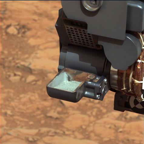 This image from NASA's Curiosity rover shows the first sample of powdered rock extracted by the rover's drill.