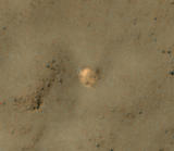 The bright feature in this image might be the parachute from a 1971 Soviet Mars lander named Mars 3.  The image was taken by the High Resolution Imaging Science Experiment (HiRISE) camera on NASA's Mars Reconnaissance Orbiter.