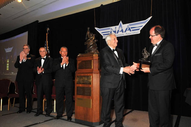 NASA's Mars Science Laboratory mission, which landed the rover Curiosity on Mars in August 2012, accepts the Robert J. Collier Trophy from the National Aeronautic Association at a ceremony in Arlington, Va., on May 9, 2013.