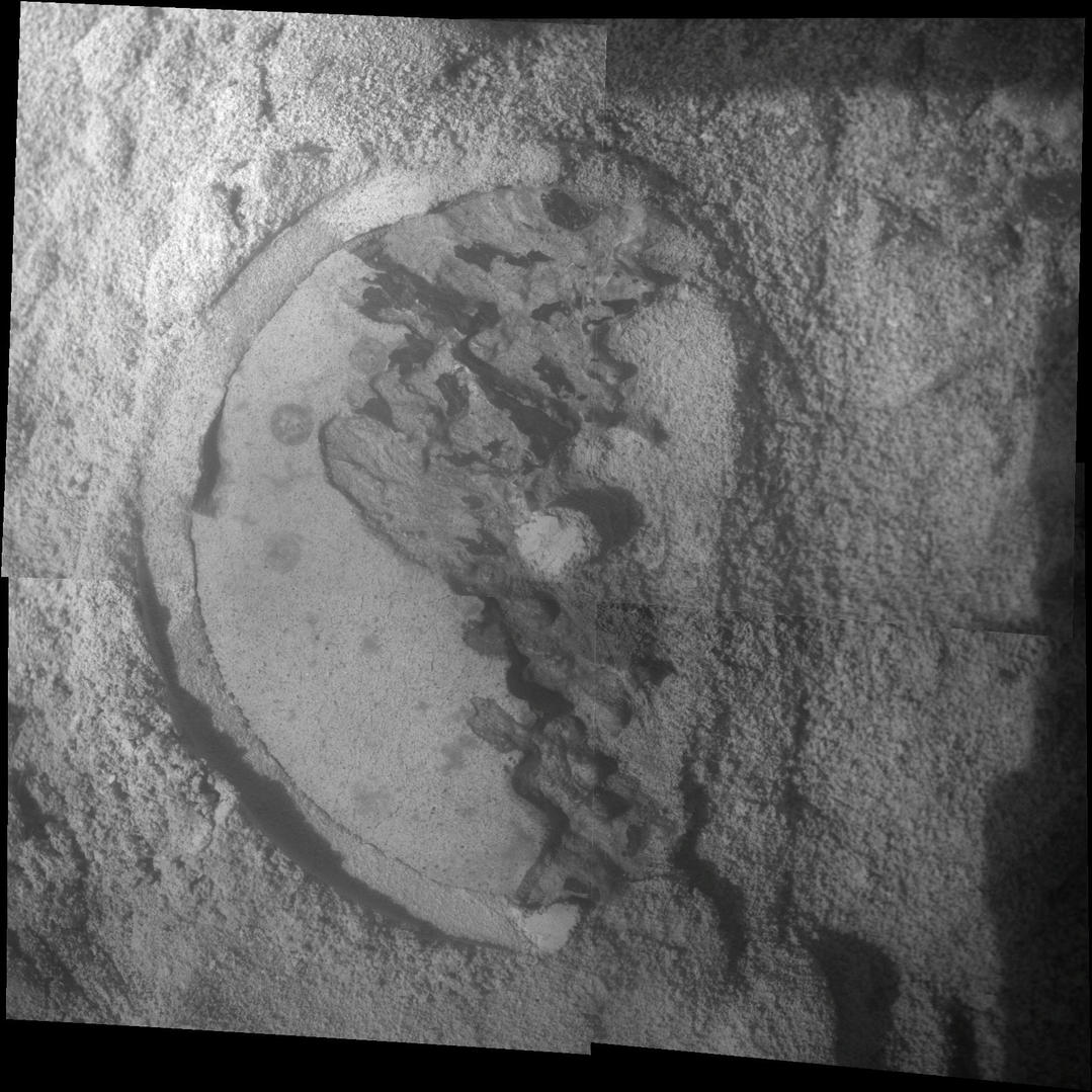 This mosaic of four frames shot by the microscopic imager on the robotic arm of NASA's Mars Exploration Rover Opportunity shows a rock target called "Esperance" after some of the rock's surface had been removed by Opportunity's rock abrasion tool, or RAT.