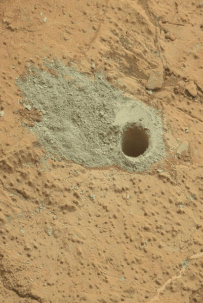 This pair of images from the Mars Hand Lens Imager (MAHLI) on NASA's Mars rover Curiosity shows the rock target "Cumberland" before and after Curiosity drilled into it to collect a sample for analysis.