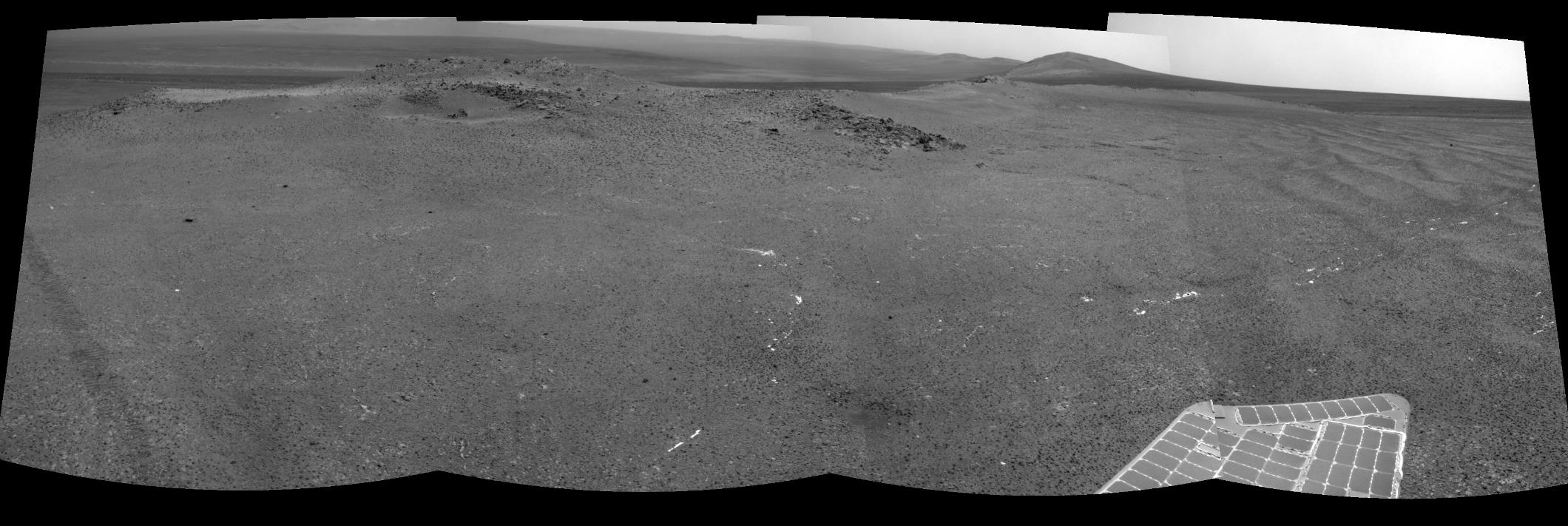 NASA's Mars Exploration Rover Opportunity used its navigation camera to record this view of a rise called "Nobbys Head" during a stop on a multi-week southward drive between two raised segments of the west rim of Endeavour Crater.