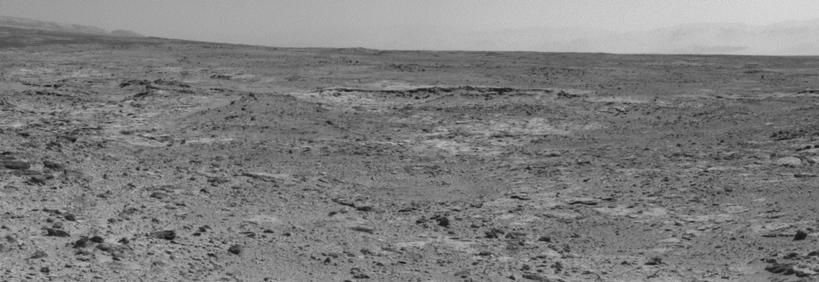 The low ridge that appears as a dark band below the horizon in the center of this scene is a Martian outcrop called "Cooperstown," a possible site for contact inspection with tools on the robotic arm of NASA's Mars rover Curiosity.