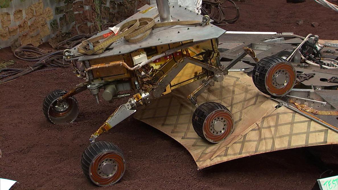 This still image illustrates what the Mars Exploration Rover Spirit will look like as it rolls off the northeastern side of the lander on Mars. The image was taken from footage of rover testing at JPL's In-Situ Instruments Laboratory, or "Testbed."