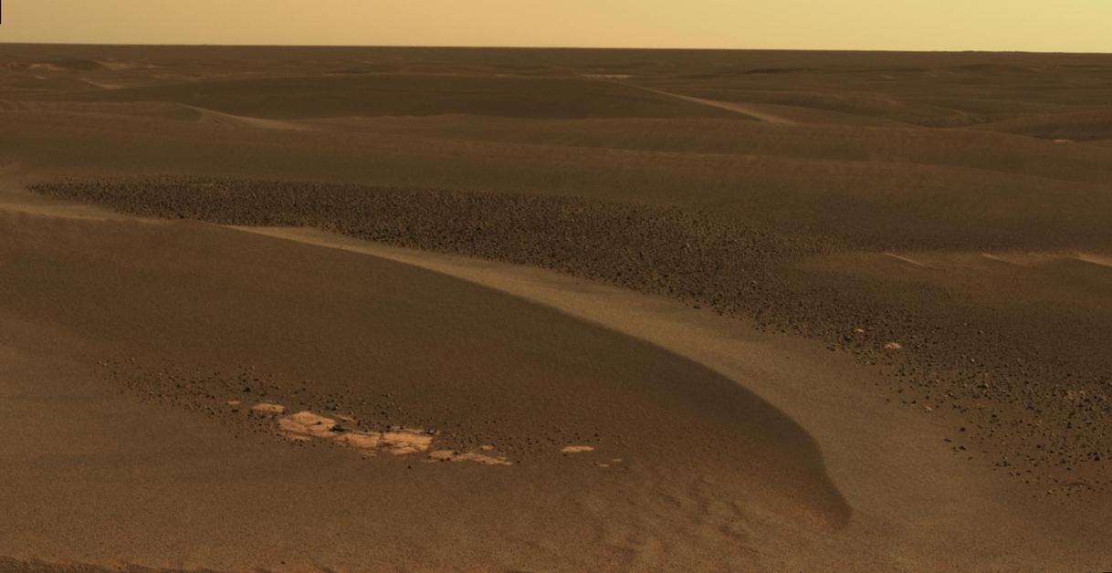 As Opportunity continued to traverse from "Erebus Crater" toward "Victoria Crater," the rover navigated along exposures of bedrock between large, wind-blown ripples.