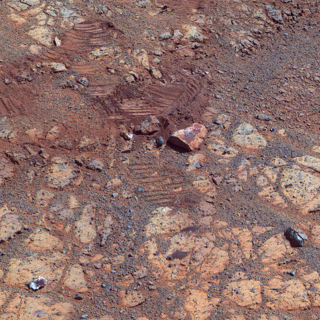 This image from the panoramic camera (Pancam) on NASA's Mars Exploration Rover Opportunity shows where a rock called "Pinnacle Island" had been before it appeared in front of the rover in early January 2014.