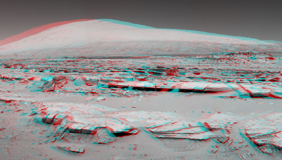 This stereo landscape scene from NASA's Curiosity Mars rover shows rows of rocks in the foreground and Mount Sharp on the horizon.