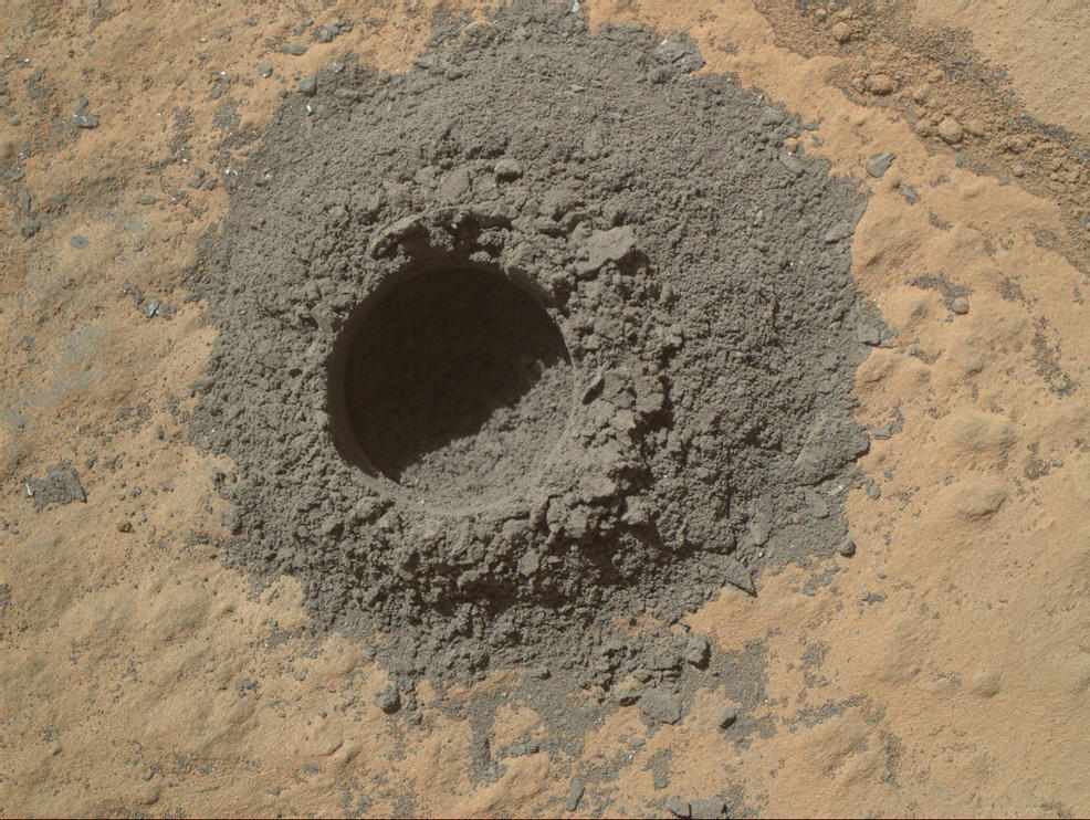 This image from Curiosity's Mars Hand Lens Imager shows the hole resulting from the test, 0.63 inch across and about 0.8 inch deep.