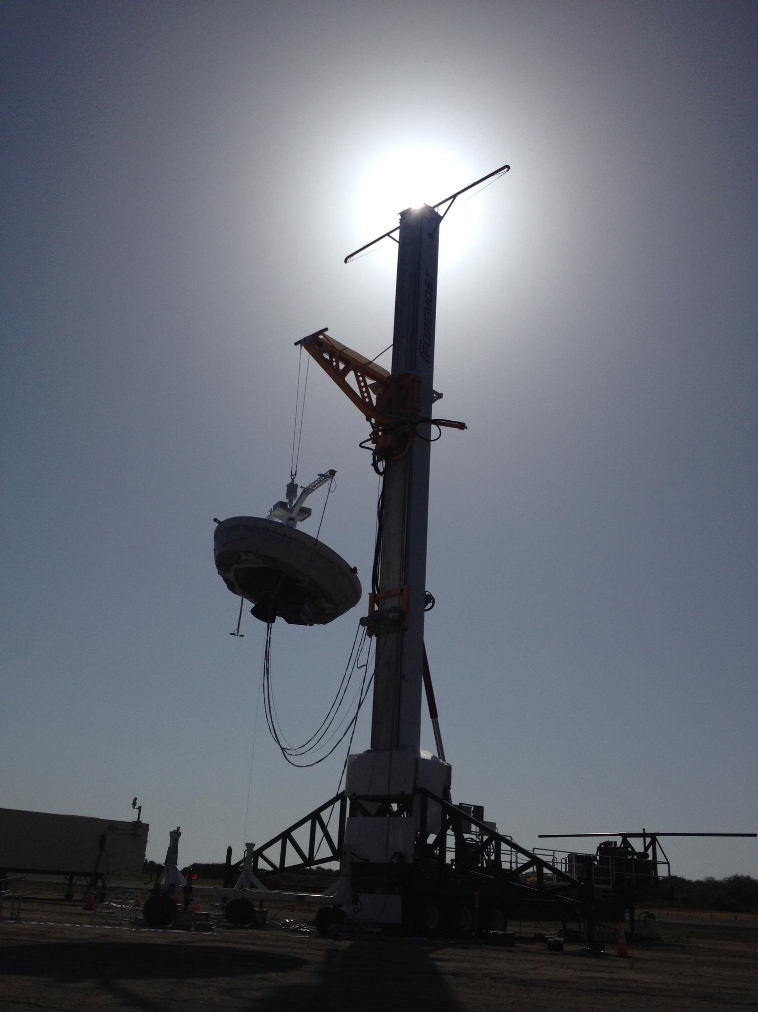 The launch tower helps link the Low-Density Supersonic Decelerator test vehicle to a balloon; once the balloon floats up, the vehicle is released from the tower and the balloon carries it to high altitudes.