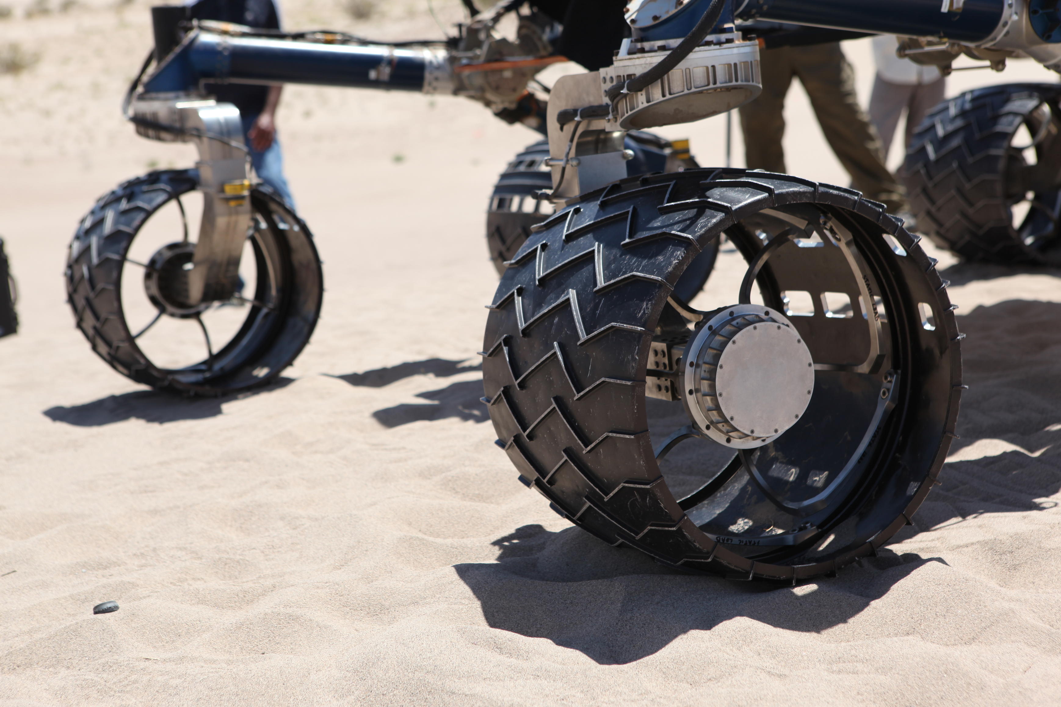 wheel, test, Scarecrow, Mars rover Rover wheels on Scarecrow with chevron-shaped treads rest on sand in Dumont dunes.