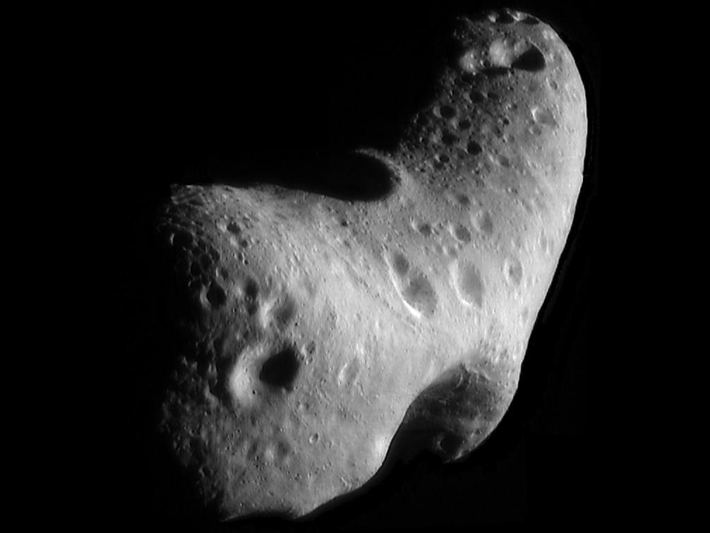 An image of a potato-shaped, gray asteroid with several craters on the surface.