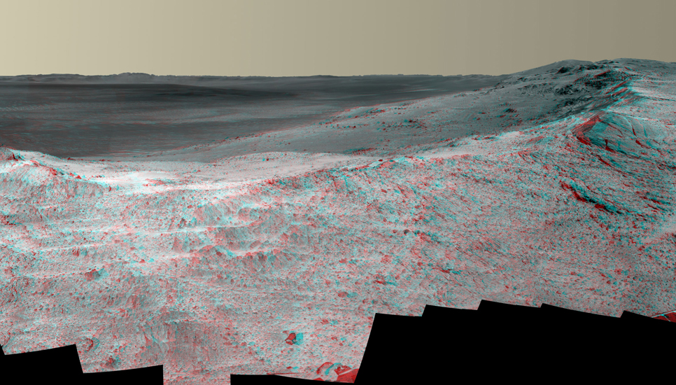 This stereo vista from the panoramic camera (Pancam) of NASA's Mars Exploration Rover Opportunity catches "Pillinger Point," on the western rim of Endeavour Crater, in the foreground.