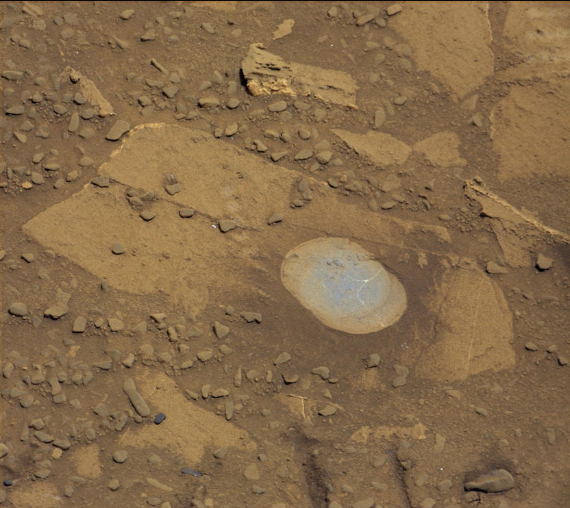 NASA's Curiosity Mars rover used its Dust Removal Tool to brush aside reddish dust, revealing gray, less-oxidized rock material at a target called "Bonanza King," visible in this Aug. 17, 2014, image from the rover's Mastcam. The rover team is evaluating this rock as a possible drilling target.