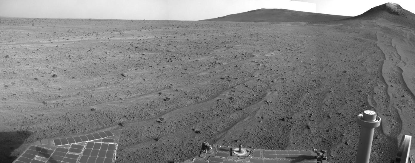 NASA's Mars Exploration Rover Opportunity captured this scene looking farther southward just after completing a southward drive, in reverse, during the 3,749th Martian day, or sol, of the rover's work on Mars (Aug. 10, 2014).