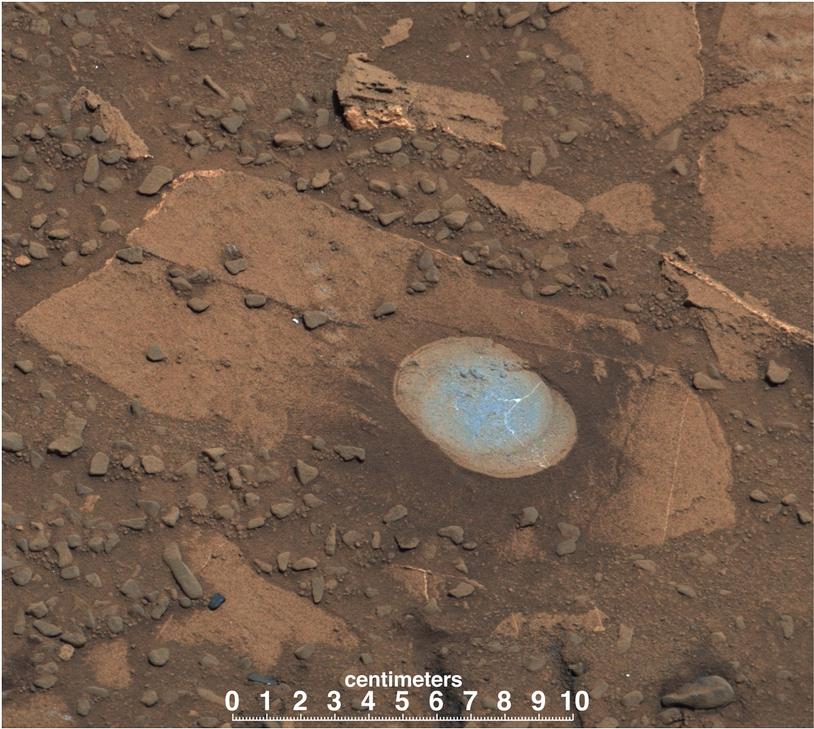 This image shows Bonanza King rock with a brown surface and in the middle is a partly drilled spot shown in lighter blue.