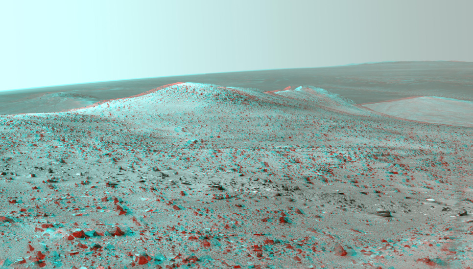 This stereo vista from NASA's Mars Exploration Rover Opportunity shows "Wdowiak Ridge," from left foreground to center, as part of a northward look with the rover's tracks visible at right.