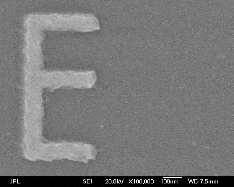 At 100,000X magnification, the lines of the letter E are about 75 billionths of a meter thick.