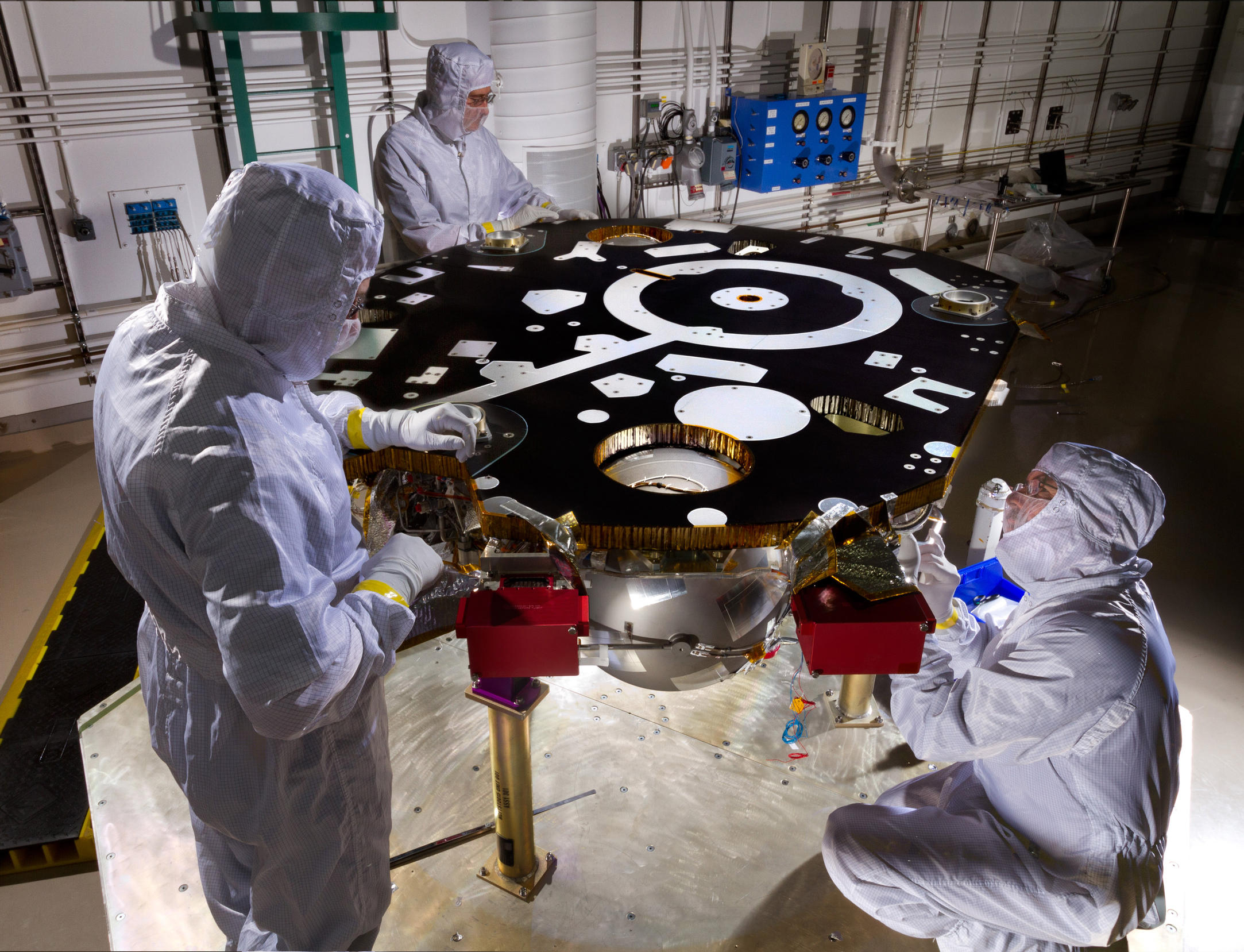 Technicians in a Lockheed Martin clean room near Denver prepare NASA's InSight Mars lander for propulsion proof and leak testing on Oct. 31, 2014.