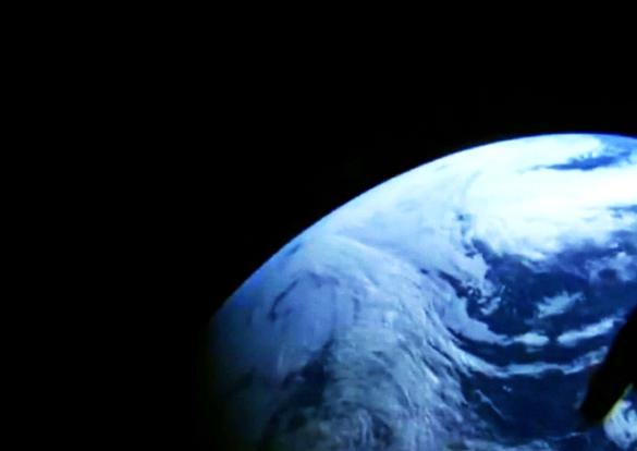 A camera in the window of NASA's Orion spacecraft looks back at Earth during its unpiloted flight test in orbit.