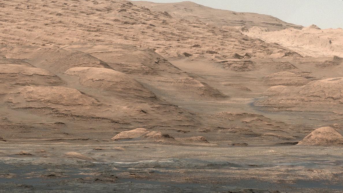 This view from the Mastcam on NASA's Curiosity Mars rover shows dramatic buttes and layers on the lower flank of Mount Sharp. It was taken on Sept. 7, 2013, from near the waypoint called "Darwin" on the route toward an entry point to the mountain.