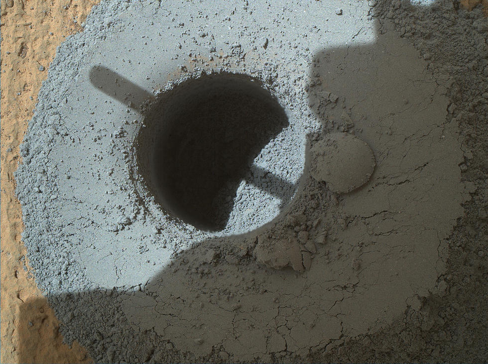 This hole, with a diameter slightly smaller than a U.S. dime, was drilled by NASA's Curiosity Mars rover into a rock target called "Telegraph Peak." The rock is located within the basal layer of Mount Sharp. The hole was drilled on Feb. 24, 2015.