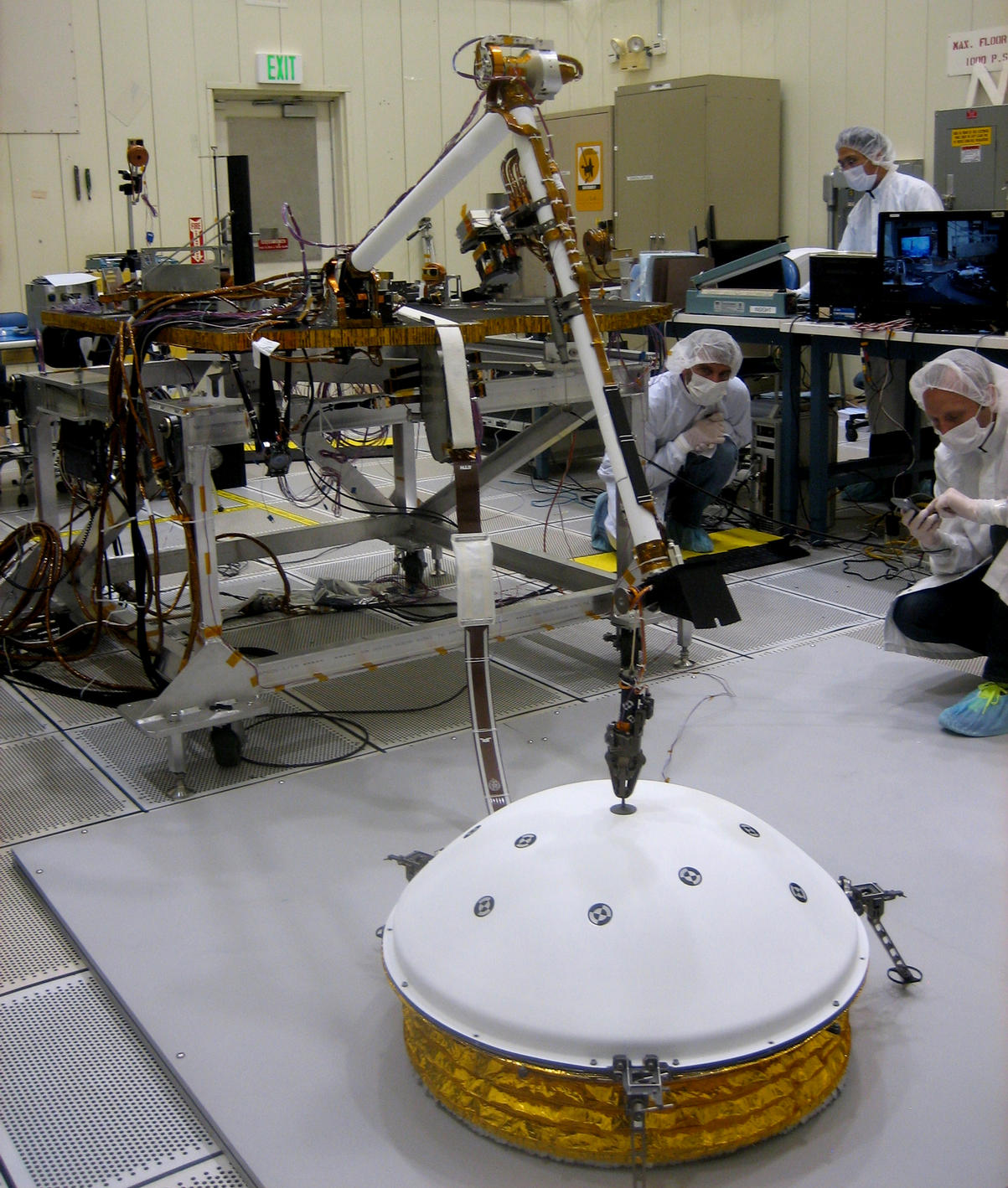 This image shows testing of InSight's robotic arm at JPL about two years before it will perform these tasks on Mars.