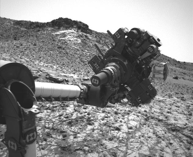 This March 4, 2015, image from the Navcam on NASA's Curiosity Mars rover shows the position in which the rover held its arm for several days after a transient short circuit triggered onboard fault-protection programming to halt arm activities on Feb. 27.