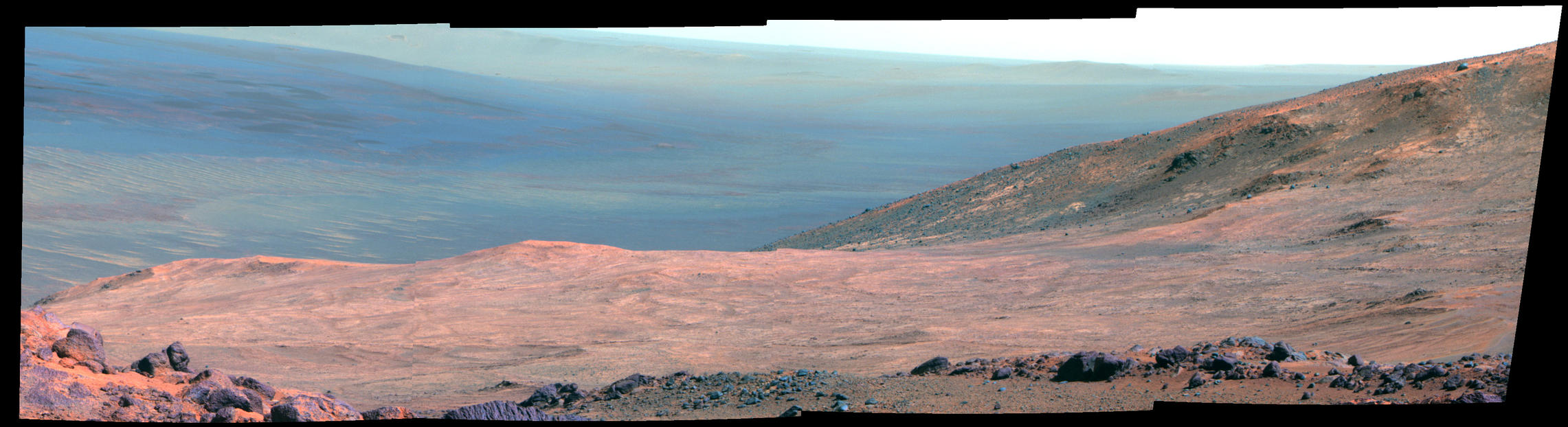 This view from NASA's Opportunity Mars rover shows part of "Marathon Valley" as seen from an overlook north of the valley. It was taken by the rover's Pancam on March 13, 2015. This version is presented in false color to make differences in surface materials more easily visible.