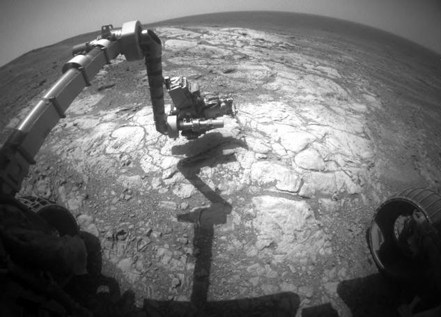 NASA's Mars Exploration Rover Opportunity has extended its robotic arm for studying a light-toned rock target called "Athens" in this March 25, 2015, image from the rover's front hazard avoidance camera.