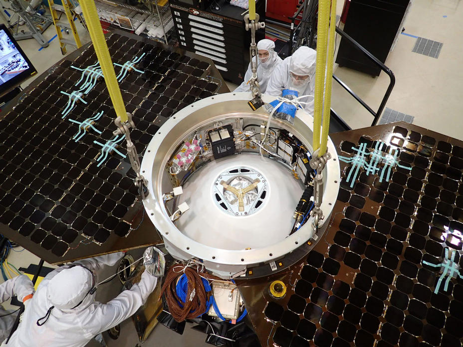 This photo shows the upper side of the cruise stage of NASA's InSight spacecraft as specialists at Lockheed Martin Space Systems, Denver, attach it to the spacecraft's back shell.