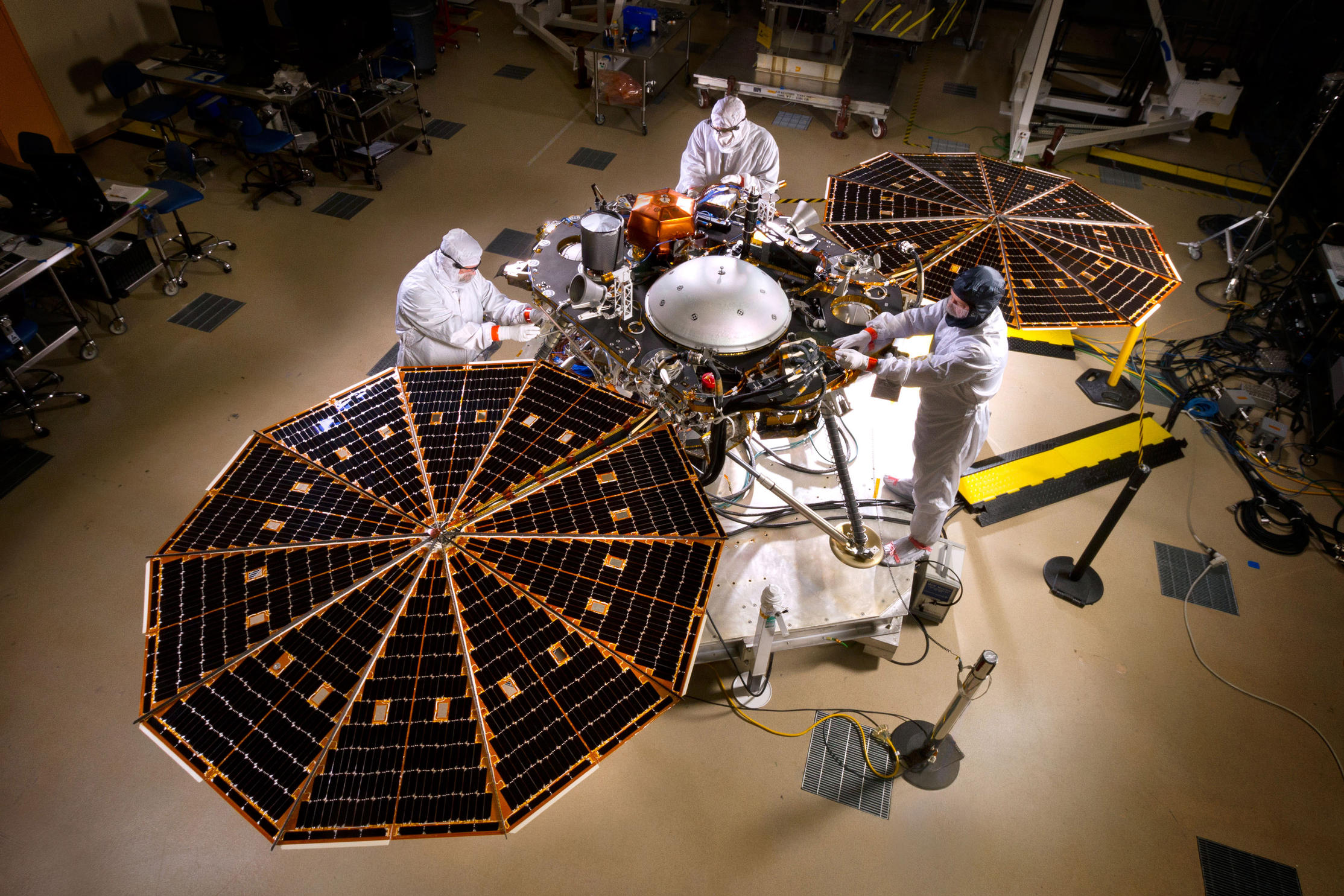 The solar arrays on NASA's InSight lander are deployed in this test inside a clean room at Lockheed Martin Space Systems, Denver.