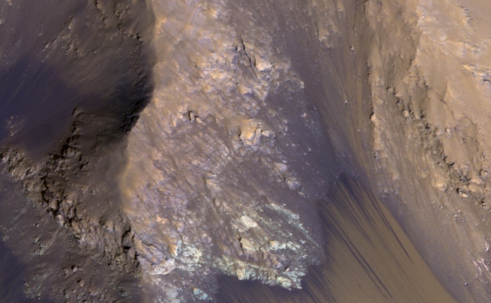 Among the many discoveries by NASA's Mars Reconnaissance Orbiter since the mission was launched on Aug. 12, 2005, are seasonal flows on some steep slopes, possibly shallow seeps of salty water. This July 21, 2015, image from the orbiter's HiRISE camera shows examples within Mars' Valles Marineris.