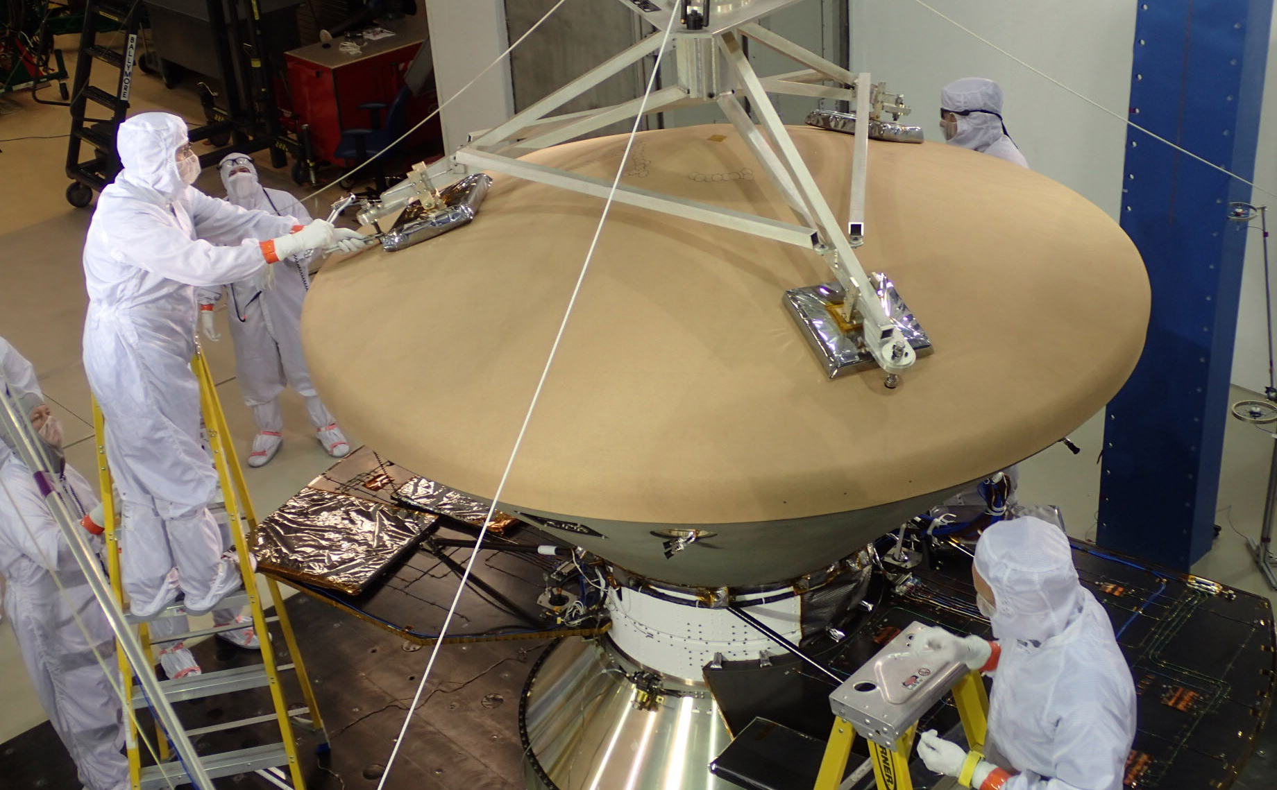 Spacecraft specialists at Lockheed Martin Space Systems, Denver, prepare NASA's InSight spacecraft for vibration testing as part of assuring that it is ready for the rigors of launch from Earth and flight to Mars.