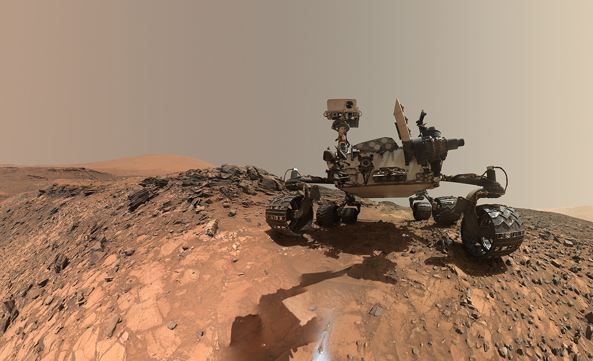 This low-angle self-portrait of NASA's Curiosity Mars rover shows the vehicle at the site from which it reached down to drill into a rock target called "Buckskin." Bright powder from that July 30, 2015, drilling is visible in the foreground.