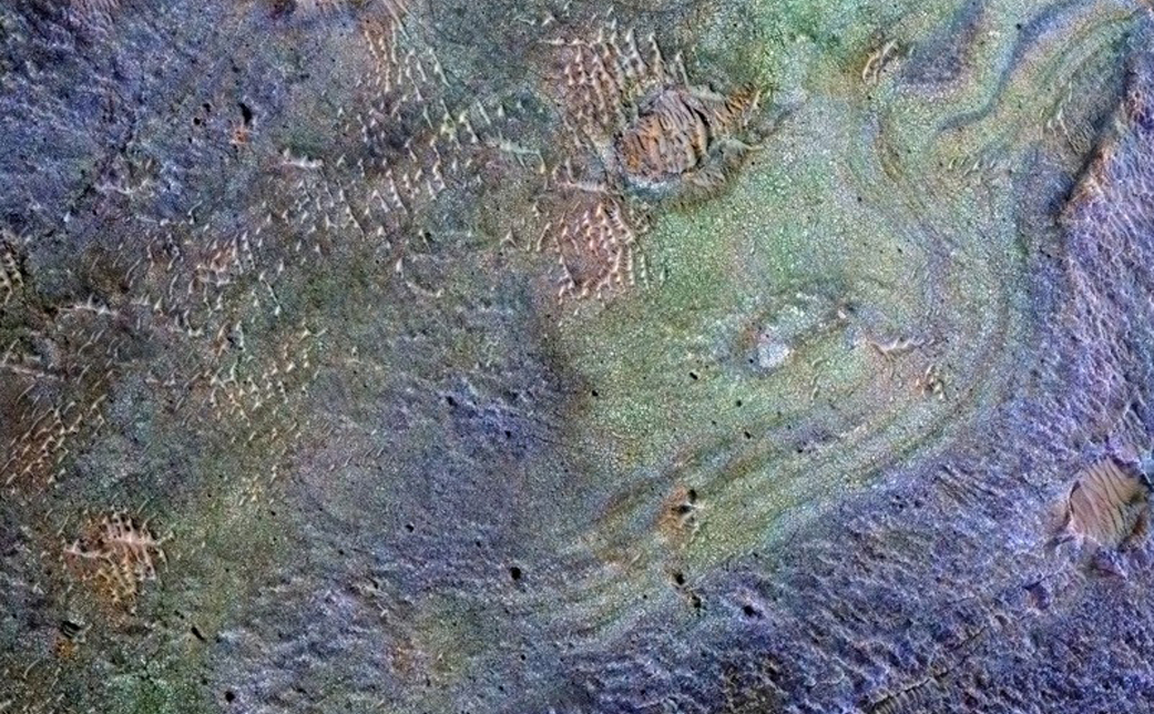 This view combines information from two instruments on a NASA Mars orbiter to map color-coded composition over the shape of the ground within the Nili Fossae plains region of Mars. Carbonate-rich deposits in this area (coded green) hold some carbon formerly in the atmosphere's carbon dioxide.