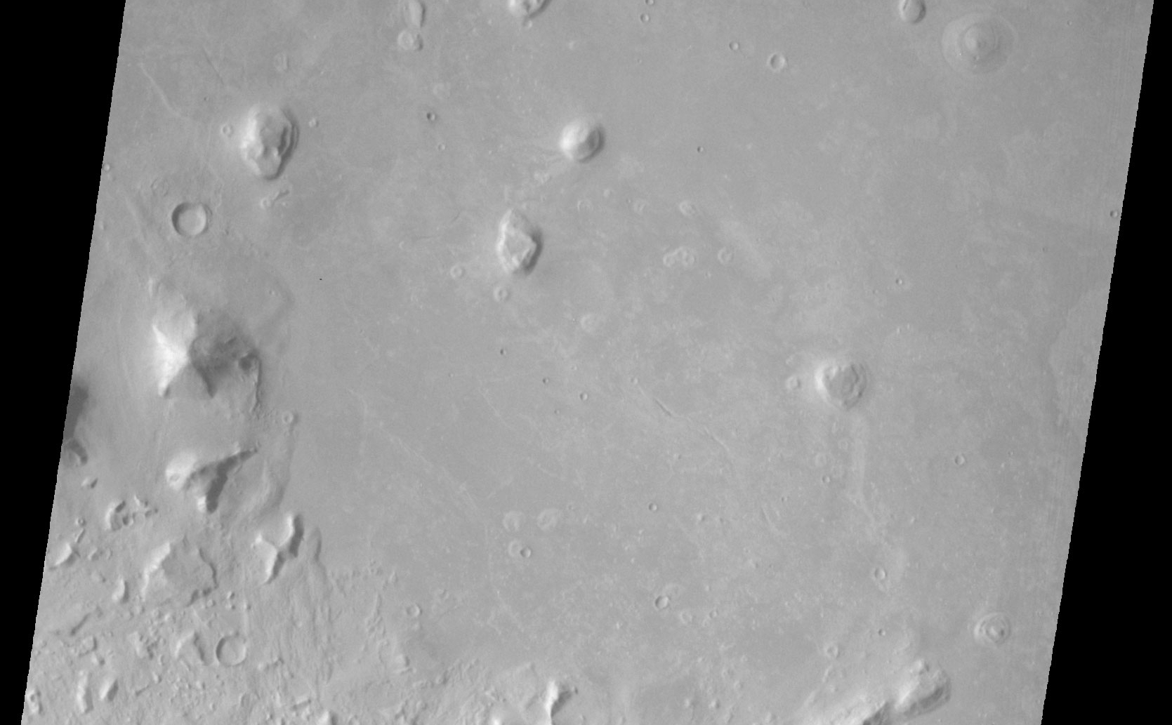 This picture is one of many taken in the northern latitudes of Mars by the Viking 1 Orbiter in search of a landing site for Viking 2.