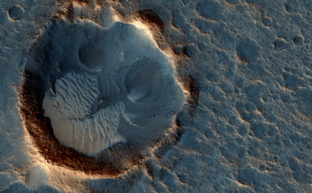 This May 2015 image from the HiRISE camera on NASA's Mars Reconnaissance Orbiter shows a location on Mars associated with the best-selling novel and Hollywood movie, "The Martian." It is in a region called Acidalia Planitia, at the landing site for the science-fiction tale's Ares 3 mission.