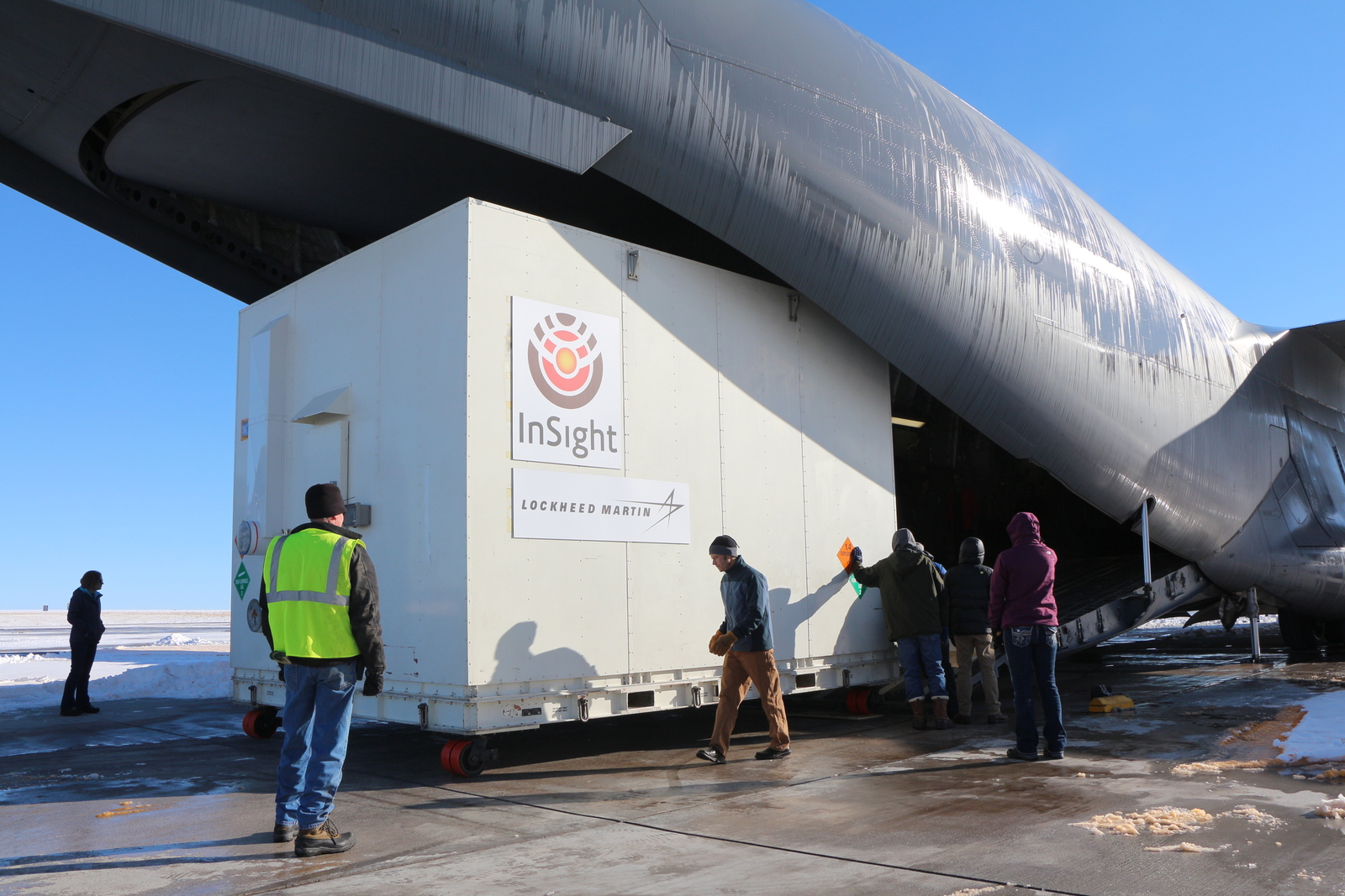 A crate containing NASA's Mars-bound InSight spacecraft is loaded into a C-17 cargo aircraft at Buckley Air Force Base, Denver, for shipment to Vandenberg Air Force Base, California.