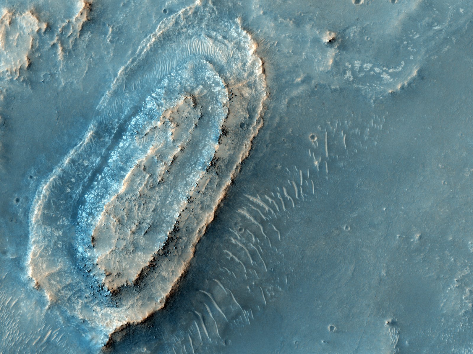 This image lies in the middle of a candidate landing site in the Northeast part of Syrtis Major, a huge shield volcano, and near the Northwest rim of Isidis Planitia, a giant impact basin.