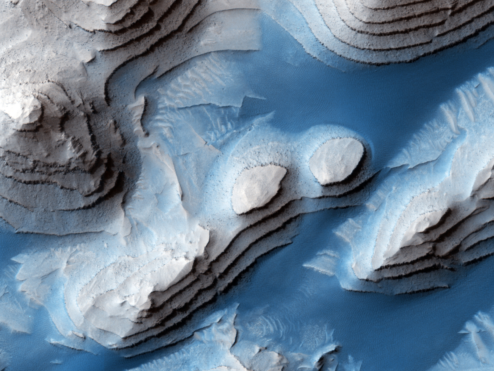 An overhead view of layered sediments in Danielson Crater on Mars