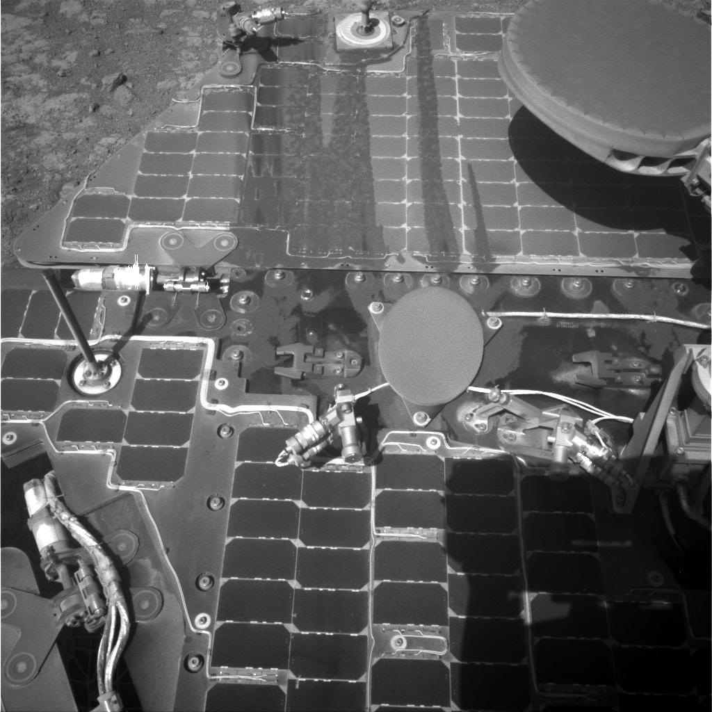 This March 21, 2016, image from the navigation camera on NASA's Mars rover Opportunity shows streaks of dust or sand on the vehicle's rear solar panel after a series of drives during which the rover was pointed steeply uphill. The tilt and jostling of the drives affected material on the rover deck.