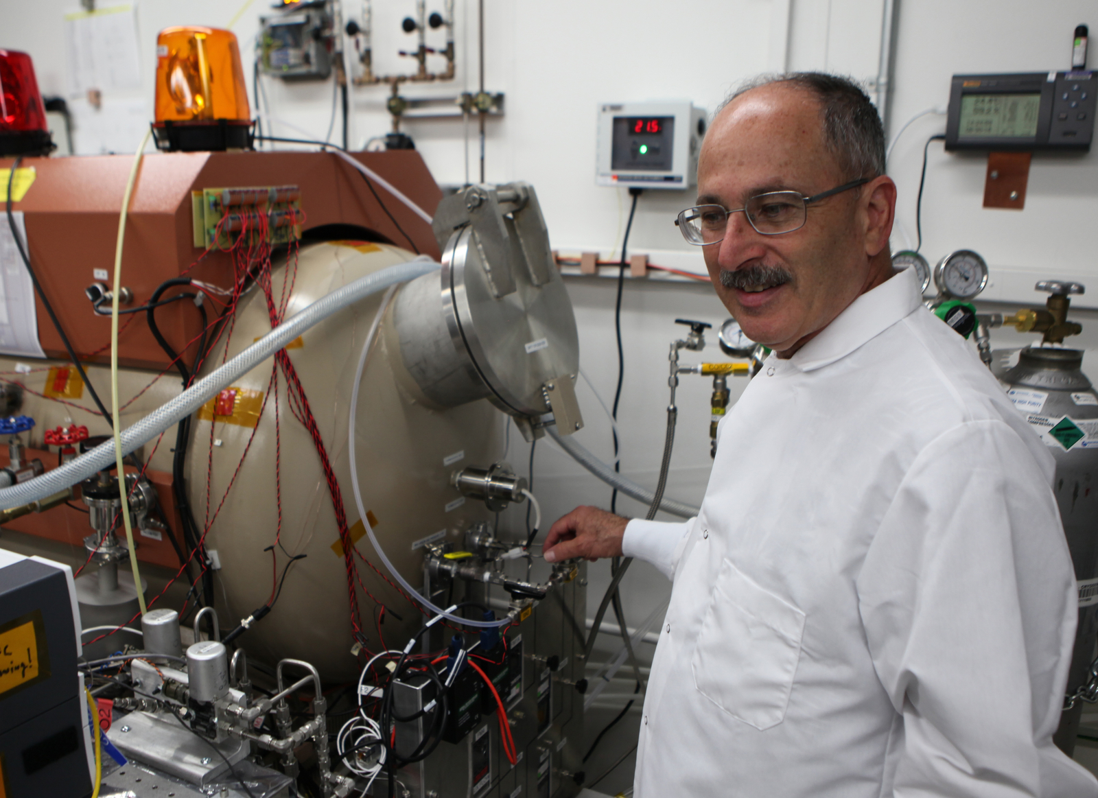 The MOXIE investigation on NASA's Mars 2020 rover will extract oxygen from the Martian atmosphere. In this image, MOXIE Principal Investigator Michael Hecht, of the Massachusetts Institute of Technology, Cambridge, is in the MOXIE laboratory at NASA's Jet Propulsion Laboratory, Pasadena, California.