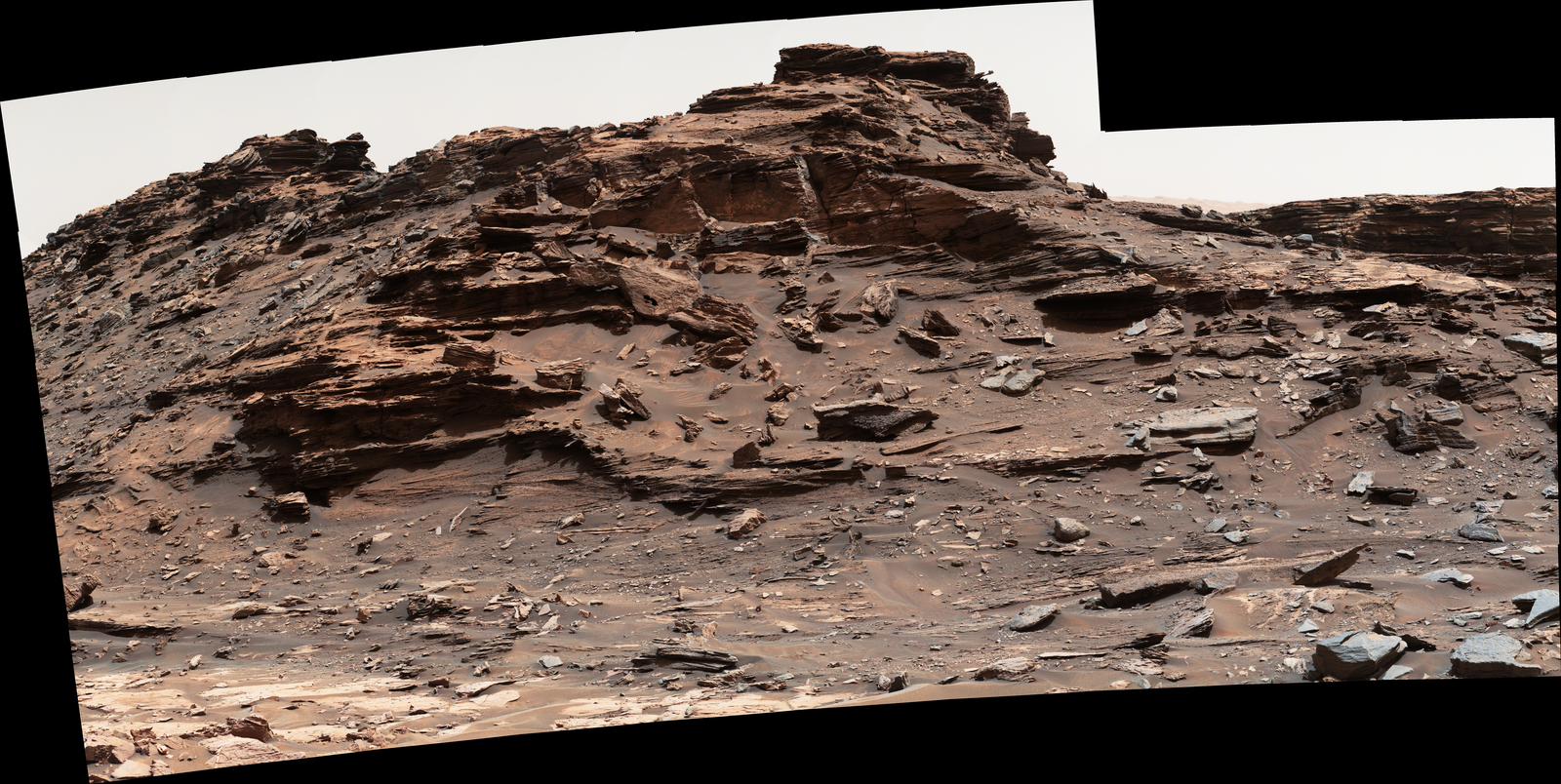 The top of the butte in this Sept. 1, 2016, scene from the Mast Camera (Mastcam) on NASA's Curiosity Mars rover stands about 16 feet above the rover and about 82 feet east-southeast of the rover. The site is in the "Murray Buttes" area of lower Mount Sharp, and this particular butte is called "M9a."