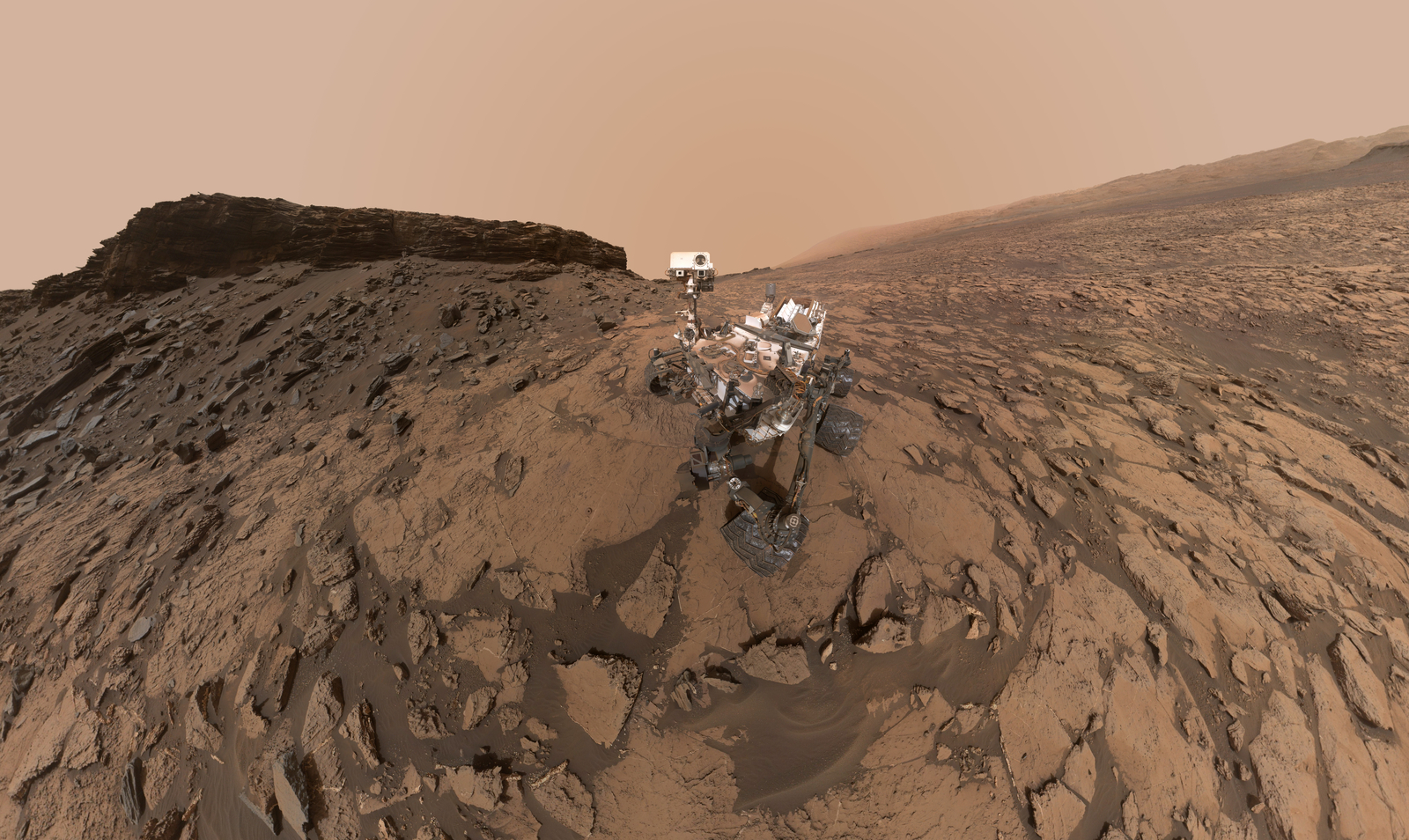 This September 2016 self-portrait of NASA's Curiosity Mars rover shows the vehicle at the "Quela" drilling location in the scenic "Murray Buttes" area on lower Mount Sharp. The panorama was stitched together from multiple images taken by the MAHLI camera at the end of the rover's arm.