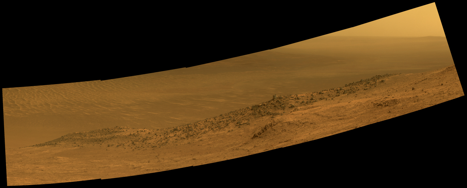 This scene from NASA's Mars rover Opportunity shows "Wharton Ridge," which forms part of the southern wall of "Marathon Valley" on the rim of Endeavour Crater. The ridge's name honors the memory of astrobiologist Robert A. Wharton (1951-2012). The scene is presented in approximately true color.