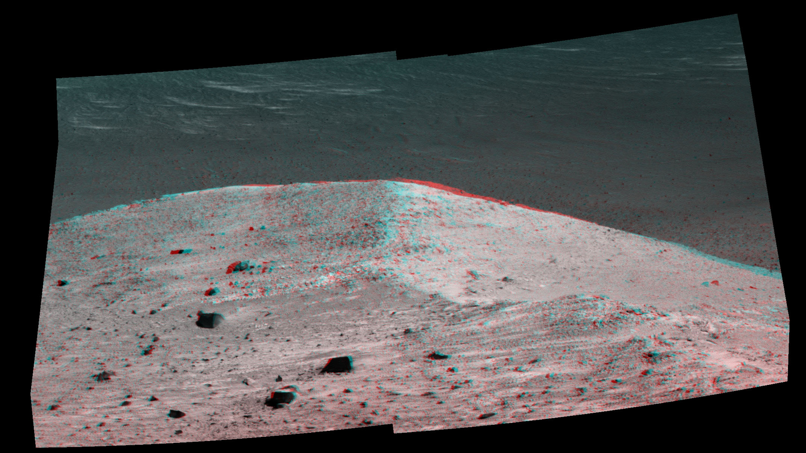 This stereo scene from NASA's Mars Exploration Rover Opportunity shows "Spirit Mound" overlooking the floor of Endeavour Crater. The view appears three-dimensional when seen through blue-red glasses with the red lens on the left.