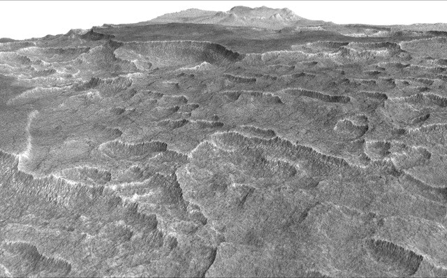 This vertically exaggerated view shows scalloped depressions in a part of Mars where such textures prompted researchers to check for buried ice, using ground-penetrating radar aboard NASA's Mars Reconnaissance Orbiter. They found about as much frozen water as the volume of Lake Superior.
