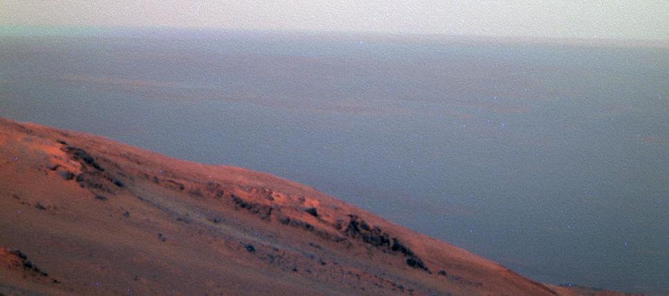 This false-color scene from the panoramic camera (Pancam) on NASA's Mars Exploration Rover Opportunity documents movement of dust as a regional dust storm approached the rover's location on Feb. 24, 2017, during the 4,653rd Martian day, or sol, of the rover's work on Mars.